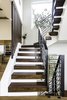 Modern home with Staircase, Wood Tread, and Metal Railing. Floating Staircase-Designed to diffuse the light as it spills through the treads/railing creating a play of light inside the home Photo 10 of The Live Oak House