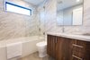Modern home with Bath Room, Granite Counter, Porcelain Tile Floor, Undermount Sink, Drop In Tub, Full Shower, Ceiling Lighting, Porcelain Tile Wall, and One Piece Toilet. Bedroom #1 Bathroom Photo 14 of The Abernathy
