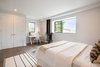 Modern home with Bedroom, Bed, Ceiling Lighting, Medium Hardwood Floor, and Chair. Upstairs bedroom #1 Photo 13 of The Abernathy