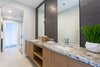 Modern home with Bath Room, Granite Counter, Porcelain Tile Floor, Undermount Sink, Full Shower, Porcelain Tile Wall, and One Piece Toilet. Jack & Jill bathroom for bedrooms 2 & 3. Photo 17 of The Abernathy