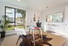 Modern home with Bedroom, Chair, Ceiling Lighting, and Medium Hardwood Floor. Downstairs bedroom Photo 18 of The Abernathy