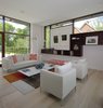 Modern home with Living Room, Bench, Sofa, Floor Lighting, Chair, Ceiling Lighting, Coffee Tables, and Light Hardwood Floor. Living Room Photo 3 of The Hearn House