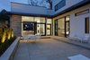 Modern home with Outdoor, Back Yard, Stone Patio, Porch, Deck, Hardscapes, Trees, and Landscape Lighting. Private Terrace Photo 7 of The Hearn House