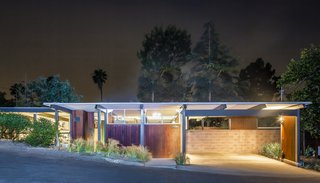 The Richard and Helen Arens House glowing gorgeously at night.