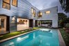 Modern home with Outdoor, Back Yard, Grass, and Concrete Patio, Porch, Deck. The Wave House by Mario Romano featuring Infratech Flush Mount WD-Series Dual Element Heaters Photo of The Wave House by Mario Romano