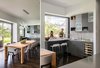 Accordion doors and multiple sliders provide one continuous indoor-outdoor experience with the living room, dining room and kitchen all opening up to the outdoor bar/lounge, dining area and grassy play area. Photo 7 of Sunset House modern home