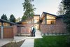 Modern home with Exterior, Mid-Century Building Type, House Building Type, and Brick Siding Material. A guest room and office wing were added to the front of the house. This left the living room roof in tact – a key feature of the original design, and created a front courtyard that define the entry sequence as a unique experience. Photo of Mid Century Re-Modern