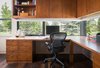 Windows at the desk level are integrated into the cabinets and provide views of the golf course. Photo 5 of Modern Golf Course Home modern home