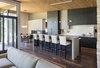 The cabinets are varied in depth to integrate the wall, cabinets and dining room fireplace. Photo 4 of Modern Golf Course Home modern home