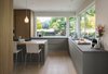 Upper cabinets were eliminated to open the kitchen to spectacular views. Photo of Flood Damaged Remodel modern home