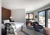 Modern home with Bedroom, Concrete Floor, Pendant Lighting, Bed, Storage, Chair, Recessed Lighting, and Bench. A cozy and comfortable guest bedroom is key to making sure guests feel welcome in your home. Photo 7 of Modern Cabin
