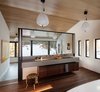 Modern home with Bath Room, Medium Hardwood Floor, Concrete Counter, and Pendant Lighting. Divided master bedroom and bathroom Photo 10 of Modern Cabin