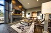 The living room features a 60" linear gas fireplace and cold rolled steel fireplace cladding. Photo of Ascent Estes Park modern home
