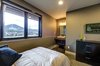 The downstairs twin bedroom features its own ensuite vanity sink. Photo 12 of Ascent Estes Park modern home