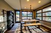 Dining set by Crate & Barrel. All living areas enjoy stunning views of the surrounding front range of the Rockies. Photo 4 of Ascent Estes Park modern home