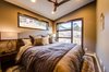 The main floor guest suite features endless up-valley views. Photo 6 of Ascent Estes Park modern home