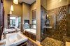 Master bathroom suite featuring Kohler fixtures and maple hardwood floors. Photo 17 of Ascent Estes Park modern home