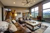 The living room features 14' ceilings, leather seating and a custom built Parallam coffee table. Photo 14 of Ascent Estes Park modern home