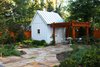 Modern home with Shed & Studio and Storage Space Room Type. The Owner, a master gardener, desired a direct visual connection to the backyard, gardens, garden shed and pergola as an integral component of the design. Photo 9 of Urban Farmhouse