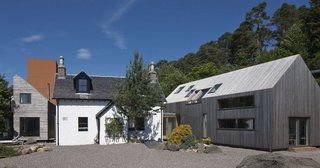 The Old Farmhouse at Invergarry was built in 1868 and has been in the Grant family for more than a century. So, it was fitting that the current owners enlisted their architect daughter, Mhairi Grant, to renovate the home to suit their modern needs. Mhairi designed a double-height internal space while retaining the historical façade, and replaced the outbuildings with two contemporary guesthouses—which connects to the main home through a glass corridor. The renovation, completed in 2014, also features a Cor-Ten tower to house the library with a third floor viewing platform. 