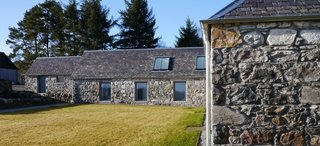 Finished in 2010, Glasgow-based Dualchas Architects converted a former L-shaped byre into a live/work space for a printmaker and textile designer. While interior concrete walls divide the working and living spaces and new windows and skylights bring in additional light, they still managed to preserve the original character of the structure.