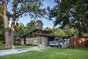 Modern home with Exterior, Metal Roof Material, House Building Type, Stone Siding Material, Wood Siding Material, and Gable RoofLine. Re-Open House by Matt Fajkus Architecture | Photo by Charles Davis Smith Photo of Re-Open House
