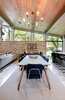 Modern home with Dining Room, Pendant Lighting, Table, Bar, Rug Floor, Chair, Stools, Storage, Concrete Floor, and Recessed Lighting. The dining space. The Joules midcentury modern chandelier was ordered from Etsy. Photo 8 of Re-Open House