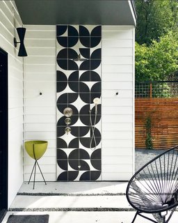 A private patio complete with an outdoor shower lies just off the master bedroom. The Cle tiles in the kitchen also feature here, unifying the outdoor space. 