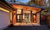 Modern home with Outdoor, Small Patio, Porch, Deck, Shrubs, Trees, Horizontal Fences, Wall, Pavers Patio, Porch, Deck, Back Yard, Hardscapes, Wood Fences, Wall, Decomposed Granite Patio, Porch, Deck, Wire Fences, Wall, Metal Fences, Wall, Tile Patio, Porch, Deck, Walkways, and Planters Patio, Porch, Deck. The increased square footage and the outdoor patios are welcome additions to the home. Photo 17 of Re-Open House