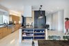 Modern home with Light Hardwood Floor, Pendant Lighting, and Recessed Lighting. The opposite view of the kitchen. Photo 11 of Mullet House
