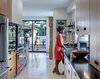 Modern home with Light Hardwood Floor. The kitchen extends out to the deck. Photo 12 of Mullet House