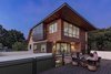 Modern home with Outdoor, Rooftop, Wood Patio, Porch, Deck, Hanging Lighting, Metal Fences, Wall, and Trees. The mullet design provides ample outdoor entertaining space for social gatherings. Photo 2 of Mullet House
