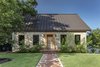 Modern home with Exterior, Metal Roof Material, House Building Type, Brick Siding Material, and Saltbox RoofLine. The original facade was transformed into a contemporary profile that pays homage to the home's humble roots. Photo 3 of Mullet House