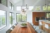 Modern home with Dining Room, Table, Chair, Stools, Pendant Lighting, Recessed Lighting, and Ceiling Lighting. Via Media Residence by Matt Fajkus Architecture | Photo by Leonid Furmansky Photo 8 of Via Media Residence