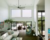 Modern home with Living Room, Recessed Lighting, Table, Sofa, Ceiling Lighting, Sectional, Coffee Tables, Console Tables, and Dark Hardwood Floor. Via Media Residence by Matt Fajkus Architecture | Photo by Leonid Furmansky Photo 11 of Via Media Residence