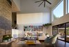 Modern home with Living Room, Sofa, Sectional, Ceiling Lighting, Recessed Lighting, Coffee Tables, Console Tables, and Dark Hardwood Floor. Via Media Residence by Matt Fajkus Architecture | Photo by Leonid Furmansky Photo 12 of Via Media Residence