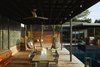 Modern home with Outdoor, Trees, Large Patio, Porch, Deck, Hot Tub Pools, Tubs, Shower, Back Yard, Metal Fences, Wall, Shower Pools, Tubs, Shower, Wood Patio, Porch, Deck, Swimming Pools, Tubs, Shower, and Landscape Lighting. Via Media Residence by Matt Fajkus Architecture | Photo by Leonid Furmansky Photo 17 of Via Media Residence