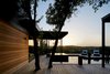 Modern home with Outdoor, Back Yard, Hot Tub Pools, Tubs, Shower, Wood Patio, Porch, Deck, Swimming Pools, Tubs, Shower, Landscape Lighting, Large Patio, Porch, Deck, Metal Fences, Wall, Trees, and Shower Pools, Tubs, Shower. Via Media Residence by Matt Fajkus Architecture | Photo by Leonid Furmansky Photo of Via Media Residence