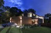 Modern home with Exterior, House Building Type, Flat RoofLine, Wood Siding Material, Stucco Siding Material, and Metal Roof Material. Add/Subtract House by Matt Fajkus Architecture | Photo by Charles Davis Smith Photo of Add/Subtract House