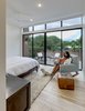 Modern home with Bedroom, Recessed Lighting, Bed, Chair, Light Hardwood Floor, and Night Stands. Add/Subtract House by Matt Fajkus Architecture | Photo by Charles Davis Smith Photo 7 of Add/Subtract House
