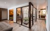 Entry of home showcasing the original atrium new flooring and open floor plan Photo 12 of Ron Molen Revival modern home
