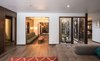 Great wide shot showing flow of the open floor plan and atrium in the middle Photo 13 of Ron Molen Revival modern home