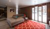 Front living room with double bumper chaise couch Photo 8 of Ron Molen Revival modern home