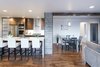 A structurally needed support beam is used as an wood accent wall that ties together with a partition door at the entry of the home. Photo 11 of King of the Wasatch modern home
