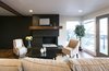 Exposed beams, full floor to ceiling windows and a converted original fireplace set the tone for this space while also honoring its original character. Photo 8 of King of the Wasatch modern home