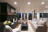 The front living room has be restored and updated by refinishing the original 2-inch oak floor and painting the brick fireplace to clean things up and updating the mantle with a matching oak veneer. Photo 6 of King of the Wasatch modern home