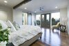 The master bedroom was thoughtfully laid out so you can take in the breathtaking views of the Salt Lake Valley each morning when you wake up. Photo 15 of King of the Wasatch modern home