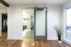 This perfectly placed barn door leads from the master bedroom to the newly renovated modern bathroom with floating cabinets and under cabinet lighting. Photo 9 of King of the Wasatch modern home