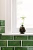 Modern home with Kitchen, Stone Counter, Medium Hardwood Floor, Subway Tile Backsplashe, and White Cabinet. A small bud vase from Heath Ceramics plays off of the Fireclay Tile subway pattern. Photo 10 of Going Old School in The Bay Area