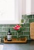 Modern home with Kitchen, Stone Counter, White Cabinet, Medium Hardwood Floor, Undermount Sink, and Subway Tile Backsplashe. A catchall anchors the necessary and decorative kitchen items. Photo 7 of Going Old School in The Bay Area